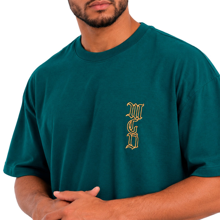 Camiseta Oversized Mcd Lateral Caligraffiti Masculino — Linha dourada sobre o verde